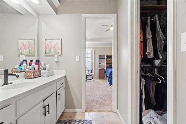 109 NW Whitlock Dr, Lees Summit, MO 64081 - bathroom with vanity, tile patterned flooring, a spacious closet, and a ceiling fan