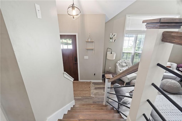 109 NW Whitlock Dr, Lees Summit, MO 64081 - foyer entrance with wood finished floors, healthy amount of natural light, stairway, and lofted ceiling