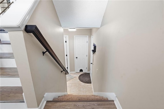 109 NW Whitlock Dr, Lees Summit, MO 64081 - staircase with baseboards and tile patterned flooring