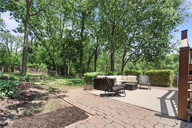 109 NW Whitlock Dr, Lees Summit, MO 64081 - fenced backyard with an outdoor living space and a patio