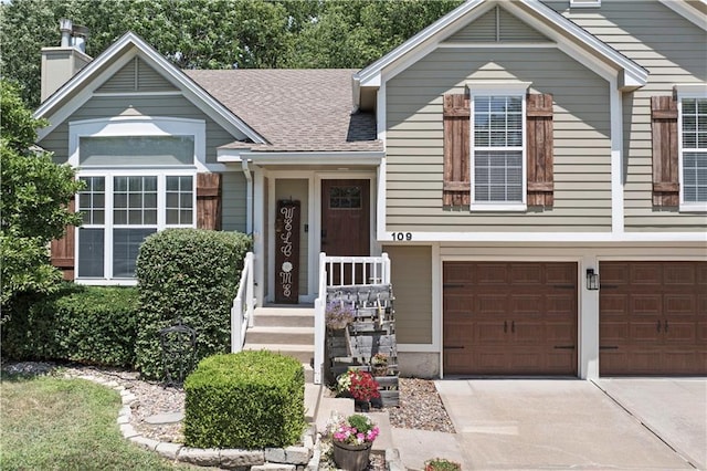 109 NW Whitlock Dr, Lees Summit, MO 64081 - view of front facade featuring a chimney, driveway, an attached garage, and roof with shingles