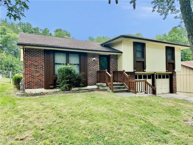 6110 NW 51st Ter, Kansas City, MO 64151 - tri-level home featuring brick siding, an attached garage, and driveway