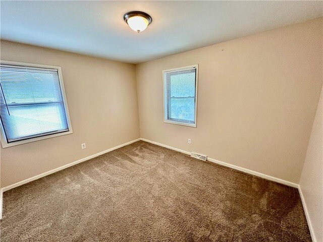 6110 NW 51st Ter, Kansas City, MO 64151 - carpeted empty room featuring baseboards