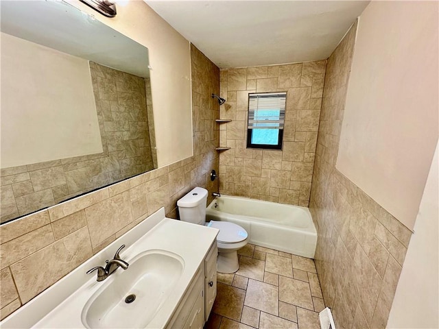 6110 NW 51st Ter, Kansas City, MO 64151 - bathroom featuring tile walls, vanity, bathtub / shower combination, and stone finish flooring