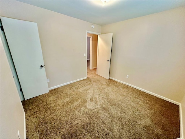 6110 NW 51st Ter, Kansas City, MO 64151 - carpeted empty room with baseboards