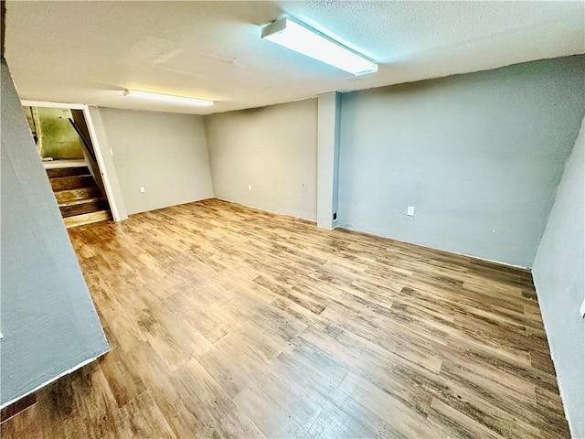 6110 NW 51st Ter, Kansas City, MO 64151 - unfurnished room featuring wood finished floors and stairway