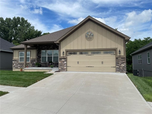 5205 University Ave, Saint Joseph, MO 64503 - craftsman inspired home featuring stone siding, board and batten siding, concrete driveway, and a front yard