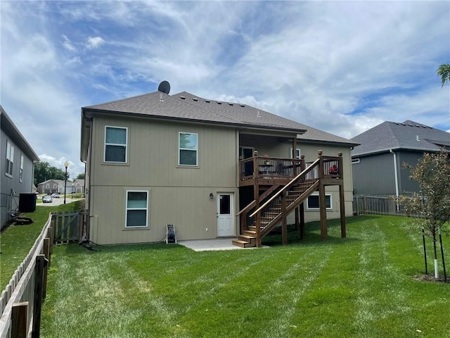 5205 University Ave, Saint Joseph, MO 64503 - rear view of property featuring stairs, a fenced backyard, a deck, and a patio