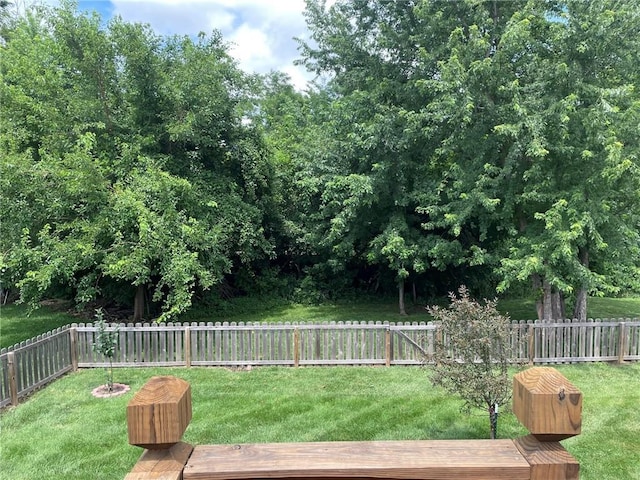 5205 University Ave, Saint Joseph, MO 64503 - fenced backyard with a deck