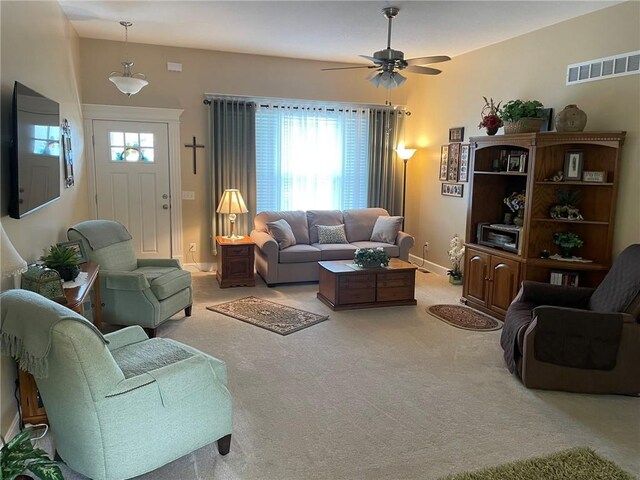 5205 University Ave, Saint Joseph, MO 64503 - living room with a ceiling fan, plenty of natural light, and light colored carpet