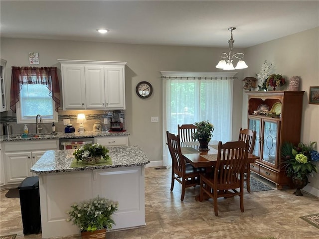 5205 University Ave, Saint Joseph, MO 64503 - dining room featuring a chandelier and recessed lighting