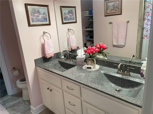 5205 University Ave, Saint Joseph, MO 64503 - bathroom with double vanity and tile patterned floors