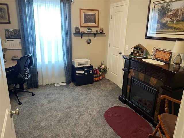 5205 University Ave, Saint Joseph, MO 64503 - home office with dark carpet and a glass covered fireplace