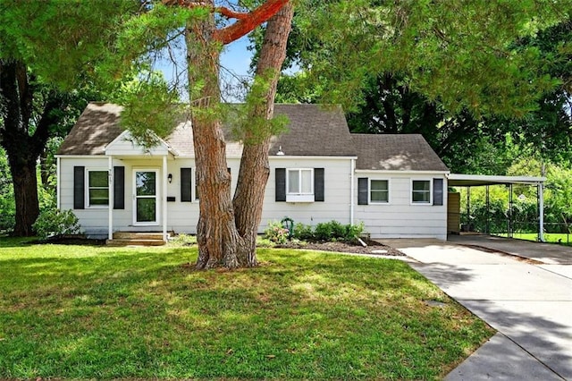 7617 W 63rd Ter, Overland Park, KS 66202 - view of front of house with driveway, a front yard, an attached carport, and a shingled roof