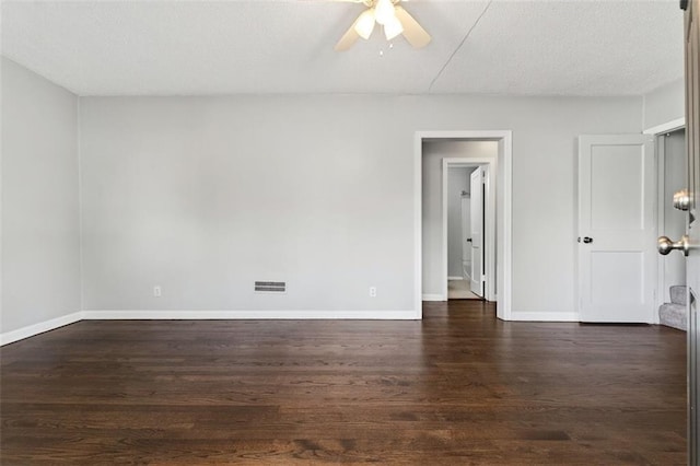7617 W 63rd Ter, Overland Park, KS 66202 - unfurnished room with ceiling fan, dark wood-style flooring, and a textured ceiling