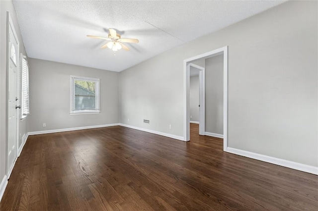 7617 W 63rd Ter, Overland Park, KS 66202 - unfurnished room with a ceiling fan, dark wood-style floors, and a textured ceiling