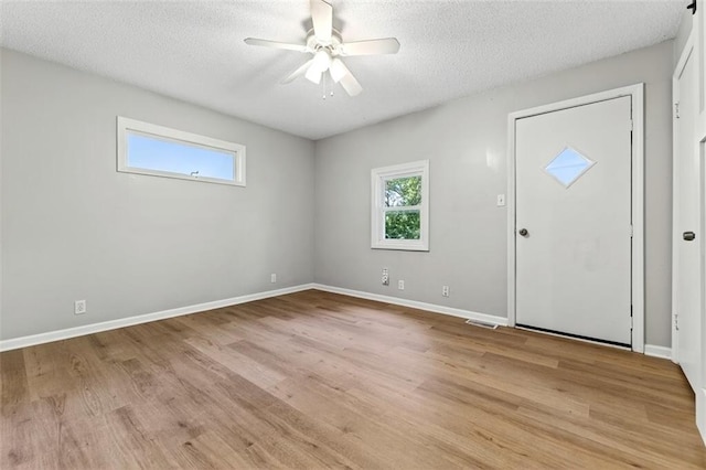 7617 W 63rd Ter, Overland Park, KS 66202 - entryway with a ceiling fan, light wood-type flooring, and a textured ceiling