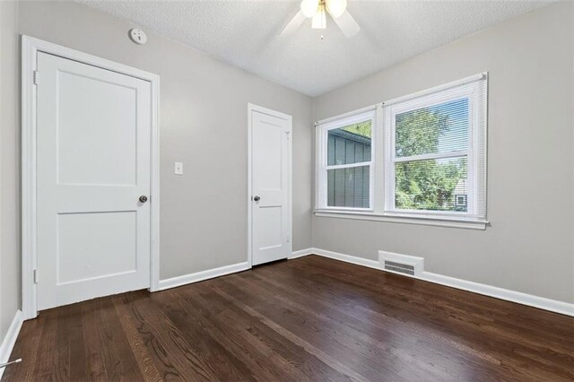 7617 W 63rd Ter, Overland Park, KS 66202 - unfurnished bedroom featuring wood finished floors, ceiling fan, and a textured ceiling