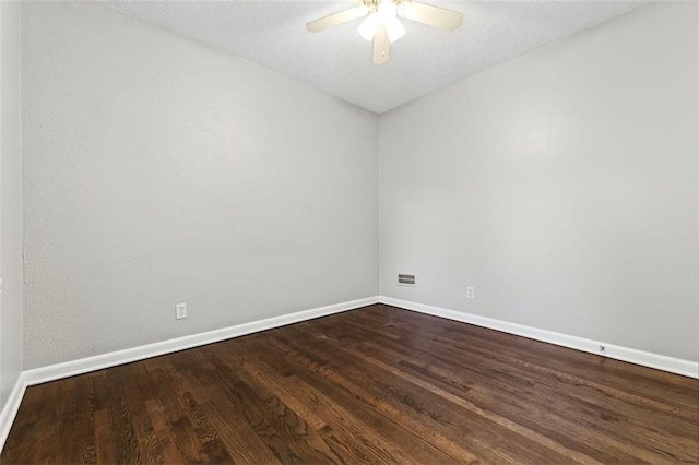 7617 W 63rd Ter, Overland Park, KS 66202 - empty room featuring a ceiling fan and dark wood finished floors