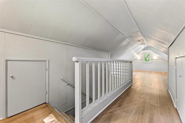 7617 W 63rd Ter, Overland Park, KS 66202 - bonus room featuring lofted ceiling and wood finished floors