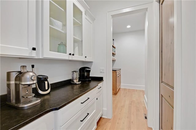 2144 W 89th Ter, Leawood, KS 66206 - bar area featuring light wood-type flooring and recessed lighting