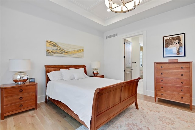 2144 W 89th Ter, Leawood, KS 66206 - bedroom with light wood-style floors, a chandelier, ensuite bathroom, and ornamental molding