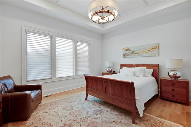 2144 W 89th Ter, Leawood, KS 66206 - bedroom with wood finished floors and a chandelier