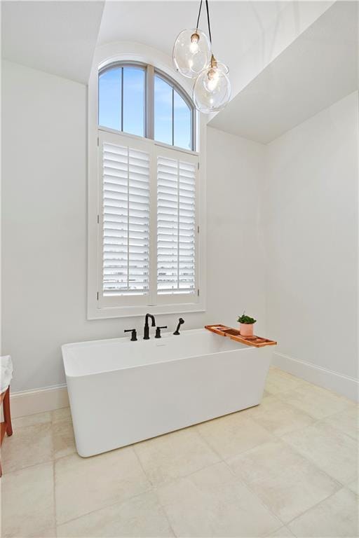2144 W 89th Ter, Leawood, KS 66206 - bathroom featuring a soaking tub and tile patterned floors