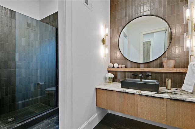 2144 W 89th Ter, Leawood, KS 66206 - bathroom featuring walk in shower, vanity, tasteful backsplash, tile patterned flooring, and tile walls