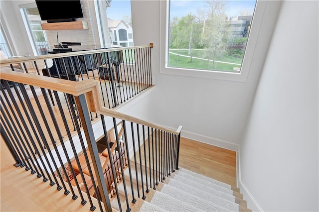 2144 W 89th Ter, Leawood, KS 66206 - stairway featuring healthy amount of natural light and wood finished floors