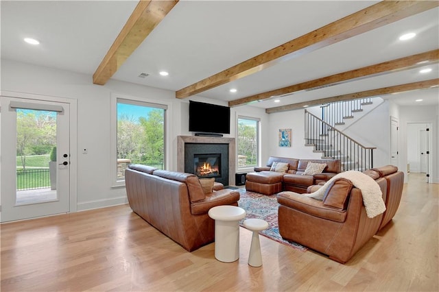2144 W 89th Ter, Leawood, KS 66206 - living room with light wood-type flooring, beam ceiling, stairs, a glass covered fireplace, and recessed lighting
