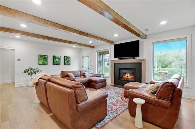 2144 W 89th Ter, Leawood, KS 66206 - living area featuring beam ceiling, light wood-style floors, recessed lighting, and a glass covered fireplace