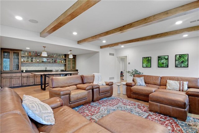 2144 W 89th Ter, Leawood, KS 66206 - living room with bar with sink, recessed lighting, beam ceiling, and light wood-style floors