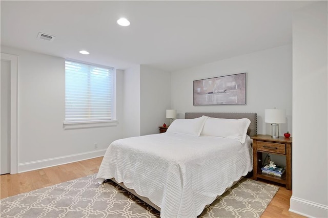 2144 W 89th Ter, Leawood, KS 66206 - bedroom with light wood-style floors and recessed lighting