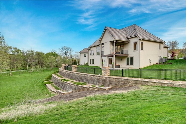 2144 W 89th Ter, Leawood, KS 66206 - back of property featuring a balcony, stucco siding, and a fenced backyard