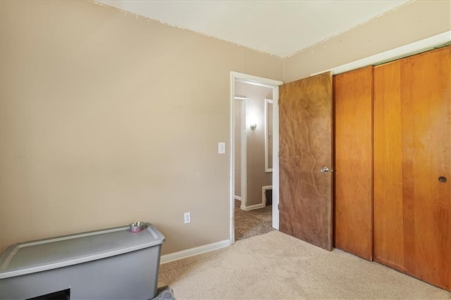 810 Vest Dr, Warrensburg, MO 64093 - bedroom featuring carpet floors and a closet