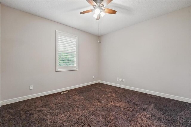 9332 W 158th St, Overland Park, KS 66221 - empty room featuring a ceiling fan and dark carpet