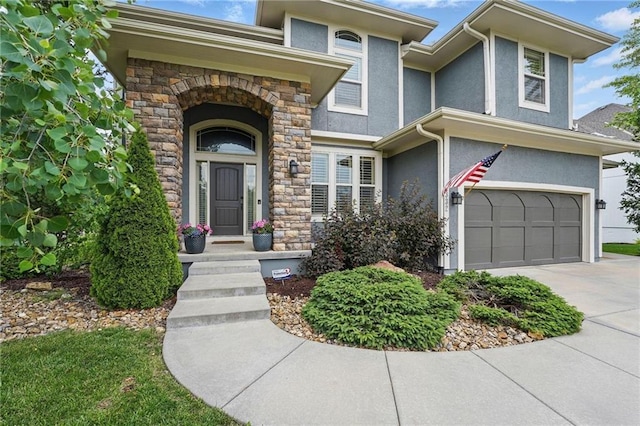 9332 W 158th St, Overland Park, KS 66221 - view of front of home featuring stucco siding, an attached garage, stone siding, and concrete driveway