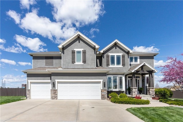 25096 W 87th St, Lenexa, KS 66227 - craftsman house featuring stucco siding, a garage, driveway, and stone siding