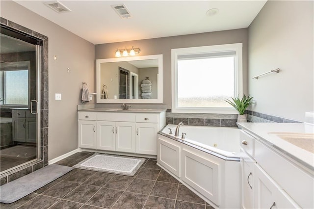 25096 W 87th St, Lenexa, KS 66227 - bathroom with vanity, a tub with jets, a shower stall, and tile patterned floors