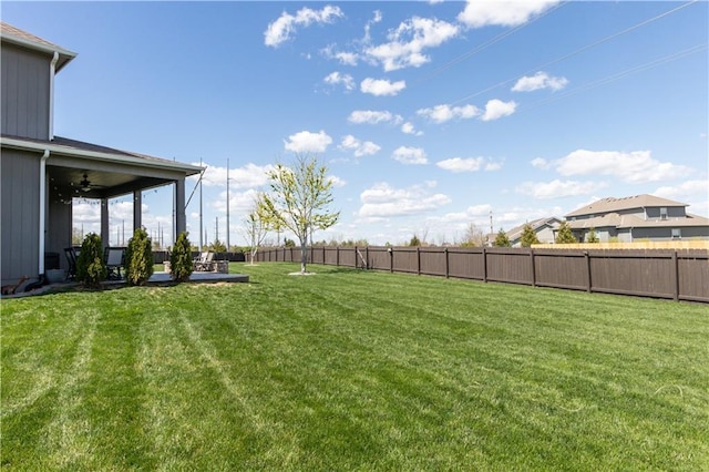 25096 W 87th St, Lenexa, KS 66227 - fenced backyard with a ceiling fan and a patio