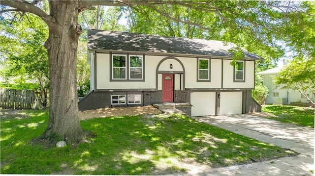 804 NW N Summit Cir, Blue Springs, MO 64015 - bi-level home featuring an attached garage, driveway, and stucco siding