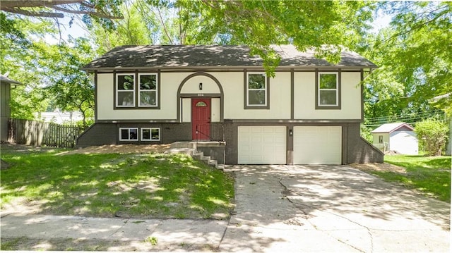804 NW N Summit Cir, Blue Springs, MO 64015 - raised ranch featuring a garage, concrete driveway, and stucco siding