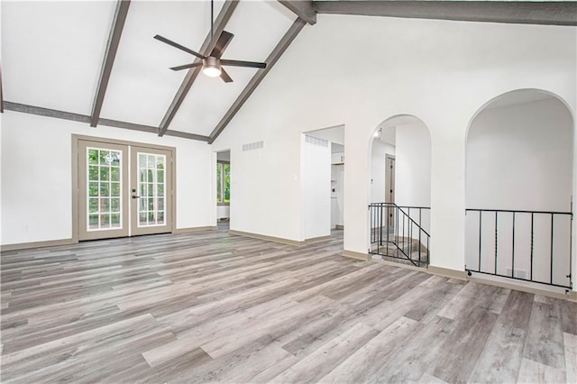804 NW N Summit Cir, Blue Springs, MO 64015 - spare room with a ceiling fan, high vaulted ceiling, wood finished floors, beamed ceiling, and arched walkways