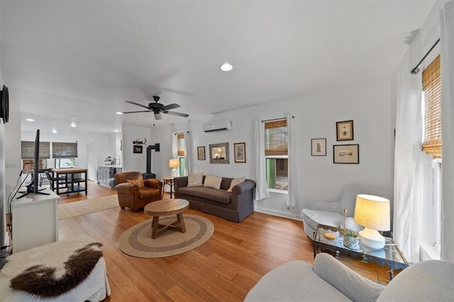 2017 W 48th St, Westwood, KS 66205 - living area with an AC wall unit, wood finished floors, recessed lighting, and ceiling fan