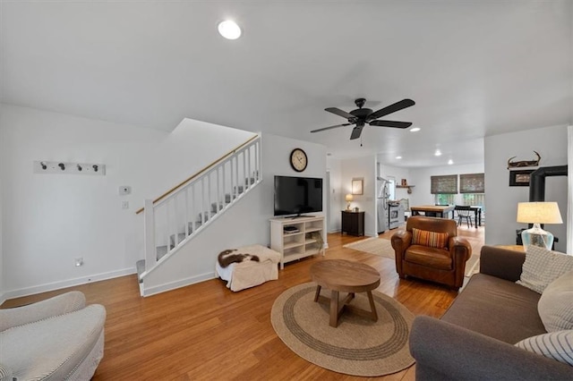 2017 W 48th St, Westwood, KS 66205 - living room with stairs, light wood-style flooring, ceiling fan, and recessed lighting