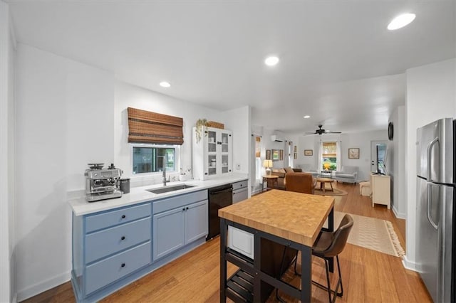 2017 W 48th St, Westwood, KS 66205 - kitchen featuring freestanding refrigerator, dishwasher, plenty of natural light, a ceiling fan, and recessed lighting