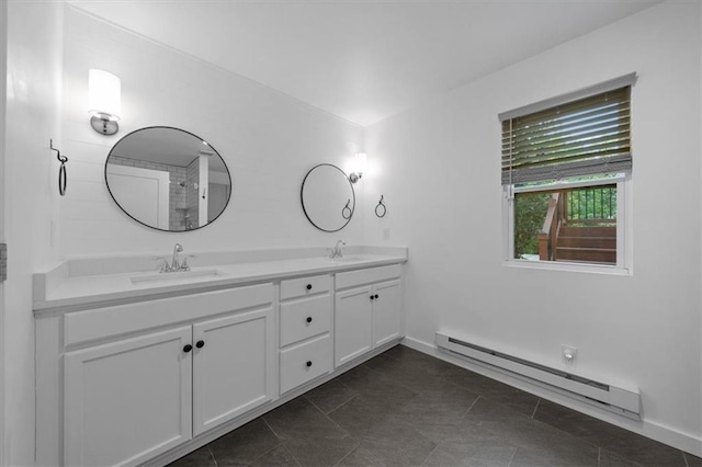 2017 W 48th St, Westwood, KS 66205 - bathroom featuring baseboard heating, double vanity, and tile patterned flooring