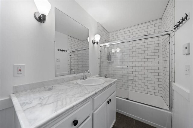 2017 W 48th St, Westwood, KS 66205 - full bathroom featuring vanity, bath / shower combo with glass door, and tile patterned floors