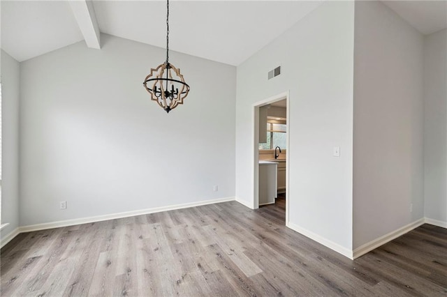 11224 Nieman Rd Unit 302, Overland Park, KS 66210 - empty room with wood finished floors and a chandelier
